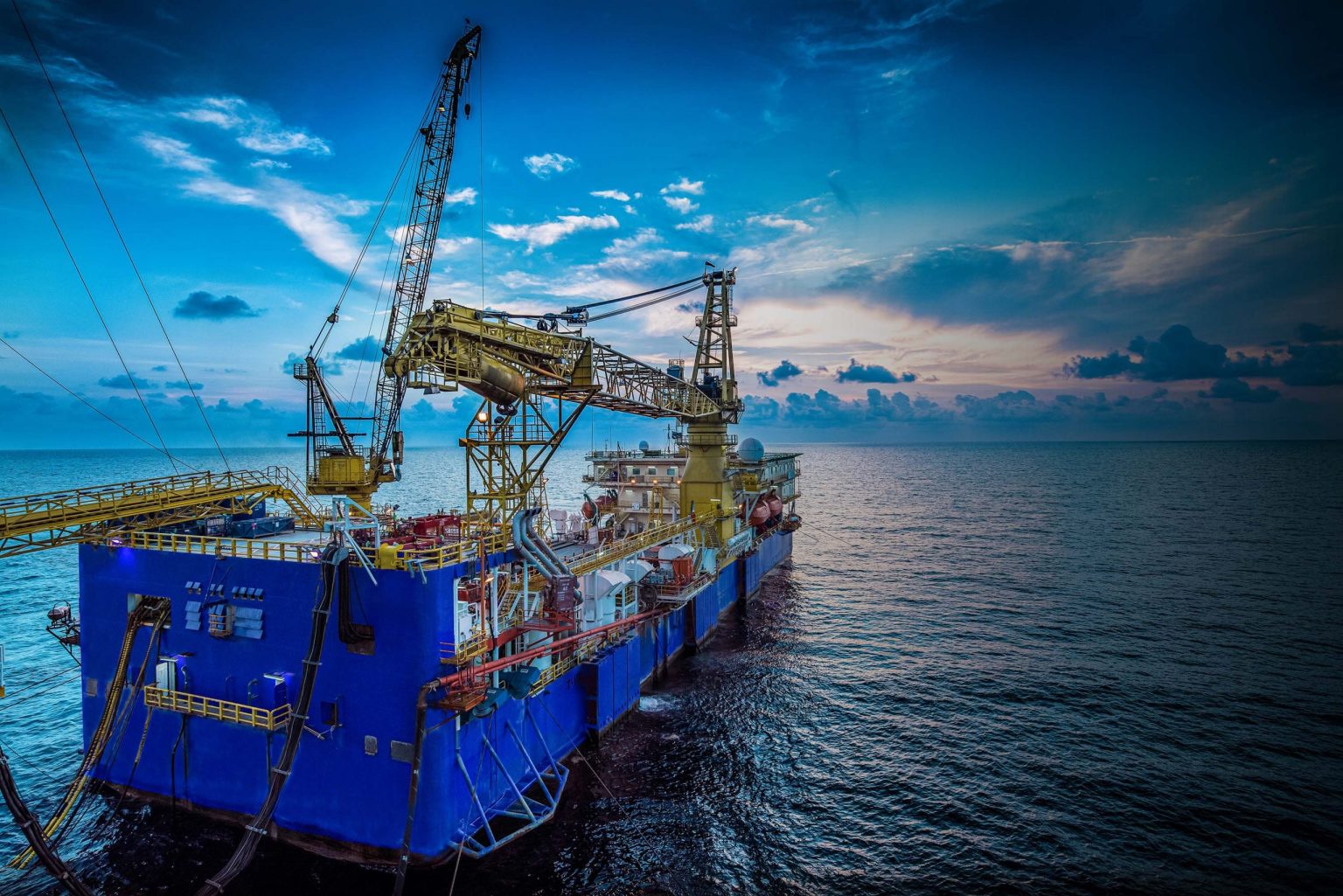 Shot of a drilling boat on the open ocean, belonging to Sapura Drilling company